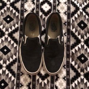 Black slip-on Vans